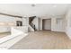 Spacious living room showcasing a kitchen, stairs, tile flooring, and natural light at 21056 N 58Th St, Phoenix, AZ 85054