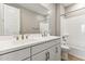 Modern bathroom featuring a double sink vanity with a shower-tub combination at 21074 N 58Th St, Phoenix, AZ 85054