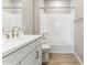 Well-lit bathroom with modern white vanity and a shower-tub combination at 21074 N 58Th St, Phoenix, AZ 85054