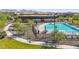 Aerial view of a community pool area with lounge chairs and landscaping, providing a relaxing and inviting outdoor space at 21074 N 58Th St, Phoenix, AZ 85054