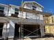 New home under construction features scaffolding and a modern design at 21112 N 58Th St, Phoenix, AZ 85054