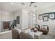 Relaxing living room features neutral paint, modern ceiling fan, and comfortable seating at 21112 N 58Th St, Phoenix, AZ 85054