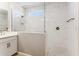 Beautiful bathroom featuring glass shower with white marble tile and a large shower head at 21122 N 58Th St, Phoenix, AZ 85054