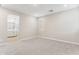 Bright bedroom with carpet, neutral walls, and a partial view into an ensuite bathroom at 21122 N 58Th St, Phoenix, AZ 85054