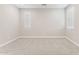 Empty bedroom with neutral carpet and three windows for ample natural light at 21122 N 58Th St, Phoenix, AZ 85054