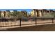 Apartment complex exterior featuring desert landscaping and black wrought iron fence at 21122 N 58Th St, Phoenix, AZ 85054