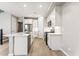 Modern kitchen featuring white cabinets, stainless steel appliances, and a center island at 21122 N 58Th St, Phoenix, AZ 85054