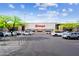 View of Target store with parking lot in the foreground, surrounded by lush green trees and a bright blue sky at 21122 N 58Th St, Phoenix, AZ 85054