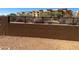 Retaining wall showing well-maintained brickwork and black metal fencing around the property at 21126 N 58Th St, Phoenix, AZ 85054