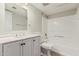 This bathroom features a white vanity with a modern sink, toilet and tub with shower at 234 N 75Th St # 209, Mesa, AZ 85207