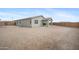 A view of the home's backyard and covered patio at 24267 W Gibson Ln, Buckeye, AZ 85326