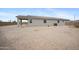 The expansive backyard features minimal landscaping at 24267 W Gibson Ln, Buckeye, AZ 85326