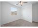 Bright bedroom with carpeted floor, a window and closet for storage at 24267 W Gibson Ln, Buckeye, AZ 85326