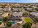 Lovely aerial view of this home, highlighting its private backyard, sparkling pool, and lush green landscaping at 2448 E Amber Ct, Gilbert, AZ 85296