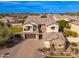 Stunning aerial view of a well-maintained home with beautiful landscaping and a paver driveway at 2448 E Amber Ct, Gilbert, AZ 85296