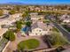 Beautiful aerial view showcases the home, lush landscaping, and the neighborhood at 2448 E Amber Ct, Gilbert, AZ 85296