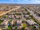 This aerial view highlights the home's location, lush landscaping, backyard pool and community amenities at 2448 E Amber Ct, Gilbert, AZ 85296