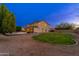 Backyard featuring a lush lawn and sparkling pool, perfect for outdoor activities and relaxation at 2448 E Amber Ct, Gilbert, AZ 85296