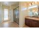 Modern bathroom featuring a glass-enclosed shower, sleek vanity, and neutral tones for a serene atmosphere at 2448 E Amber Ct, Gilbert, AZ 85296