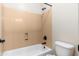 Bathroom with white tub, shower, and toilet at 2448 E Amber Ct, Gilbert, AZ 85296