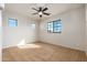 Bright, carpeted bedroom with natural light and a modern ceiling fan at 2448 E Amber Ct, Gilbert, AZ 85296