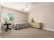 Neutral bedroom with carpet, ceiling fan, and good natural light at 2467 E Page Ave, Gilbert, AZ 85234