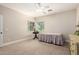 Neutral bedroom with carpet, ceiling fan, and good natural light at 2467 E Page Ave, Gilbert, AZ 85234