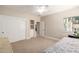 Bedroom featuring carpet, ceiling fan, closet, and natural light at 2467 E Page Ave, Gilbert, AZ 85234