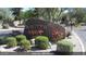 Community entrance sign surrounded by desert landscaping and flowering shrubs at 2467 E Page Ave, Gilbert, AZ 85234