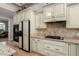 Close up shot of the stove and cabinets in this open-concept kitchen at 2467 E Page Ave, Gilbert, AZ 85234