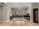 Open-concept living room featuring neutral tones, comfortable seating, and a view into the entryway and dining room at 2467 E Page Ave, Gilbert, AZ 85234