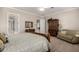 Inviting main bedroom featuring a decorative bed frame, comfortable seating, and classic decor at 2467 E Page Ave, Gilbert, AZ 85234