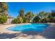 A private backyard pool, perfect for relaxation and enjoying sunny days in a landscaped setting at 2467 E Page Ave, Gilbert, AZ 85234