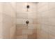 Tiled shower features modern fixtures and neutral color palette at 2467 E Page Ave, Gilbert, AZ 85234