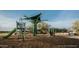 Modern green playground, slide, and shade structure at 2468 W Rowel Rd, Phoenix, AZ 85085