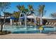 Interactive splash pad featuring water fountains and play elements for Gathering fun on a sunny day at 2468 W Rowel Rd, Phoenix, AZ 85085