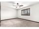 Bedroom featuring carpeted floors, a ceiling fan, and natural light from a large window at 2873 E Nolan Pl, Chandler, AZ 85249