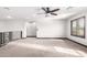 Large room with plush neutral carpet and plantation shutters at 2873 E Nolan Pl, Chandler, AZ 85249