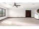 Spacious bedroom featuring neutral carpet, a ceiling fan and plantation shutters at 2873 E Nolan Pl, Chandler, AZ 85249