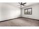 Minimalist bedroom with carpet, neutral walls, and single shuttered window offering natural light at 2873 E Nolan Pl, Chandler, AZ 85249