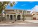 Charming two-story home with a three-car garage, arched entryway, and desert landscaping at 2873 E Nolan Pl, Chandler, AZ 85249