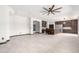 Spacious living room with a view of the open-concept kitchen, perfect for entertaining at 2873 E Nolan Pl, Chandler, AZ 85249