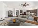 Staged living room showcasing an open concept, with the kitchen and dining area visible at 2873 E Nolan Pl, Chandler, AZ 85249