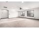 Spacious living room with carpet, neutral walls, and two shuttered windows bringing natural light at 2873 E Nolan Pl, Chandler, AZ 85249