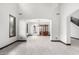 Open-concept living room showcasing tile floors and neutral tones, seamlessly flowing into other spaces at 2873 E Nolan Pl, Chandler, AZ 85249