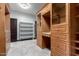 Custom walk-in closet with built-in shelves and drawers plus a secondary door at 2873 E Nolan Pl, Chandler, AZ 85249