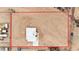 Aerial view of property with modern home and the parcel outlined in red at 29810 W Bellview St, Buckeye, AZ 85396