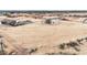 Aerial view of a single-story stucco home with a flat roof and a large lot at 29810 W Bellview St, Buckeye, AZ 85396