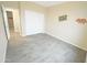 Neutral bedroom with wood look floors and closet with white sliding doors at 29810 W Bellview St, Buckeye, AZ 85396