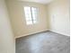 Bedroom with modern wood flooring, a large window and neutral paint at 29810 W Bellview St, Buckeye, AZ 85396